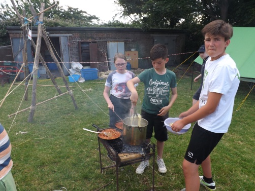 Scouts cooking dinner